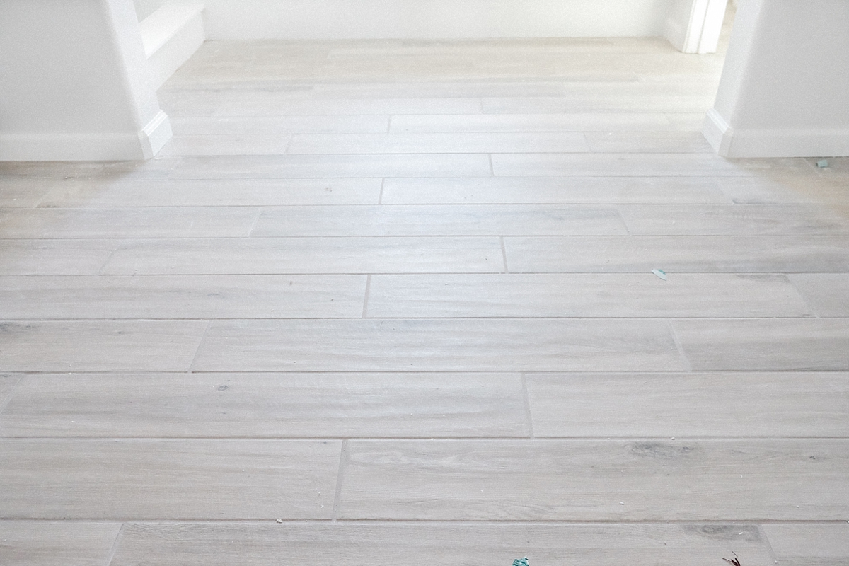 Wood look tile floor in master bathroom